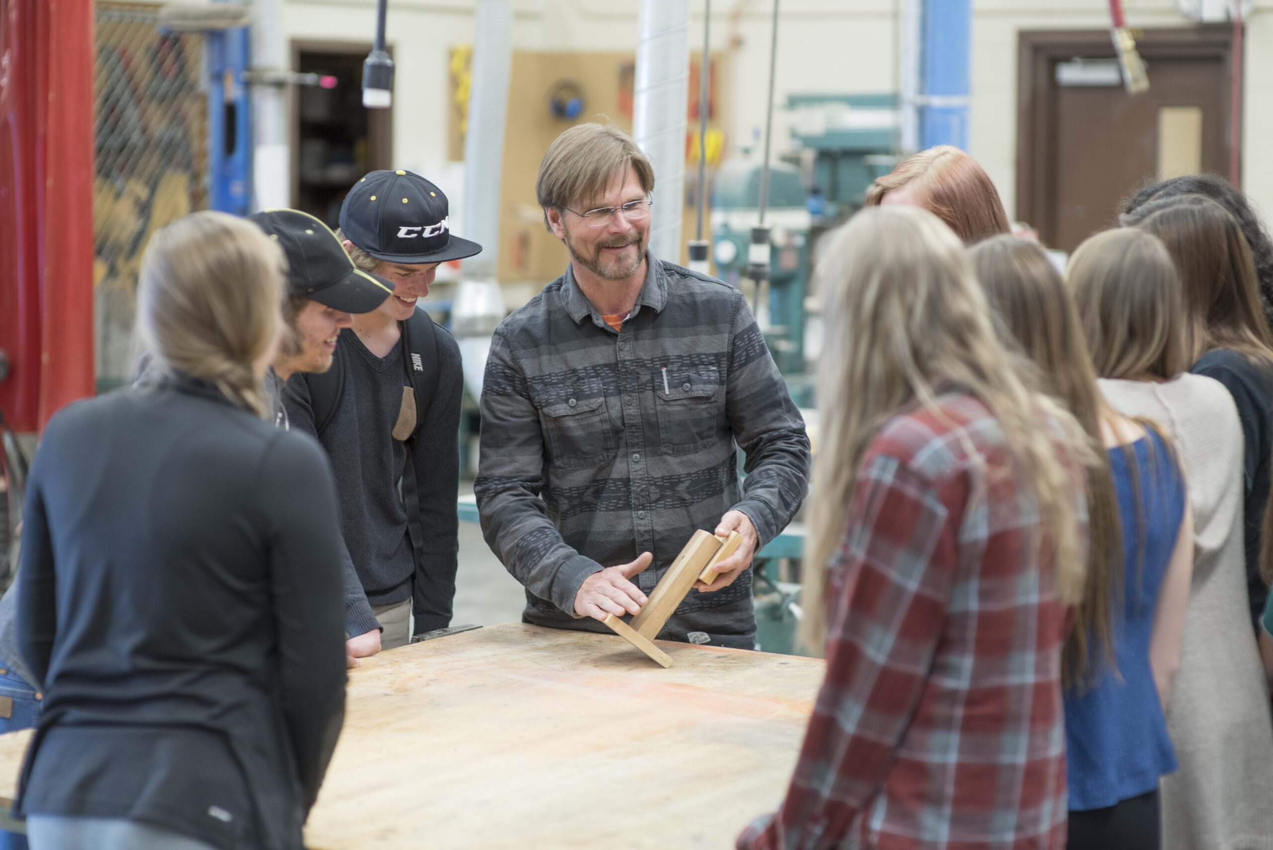 Woodworking teacher with students