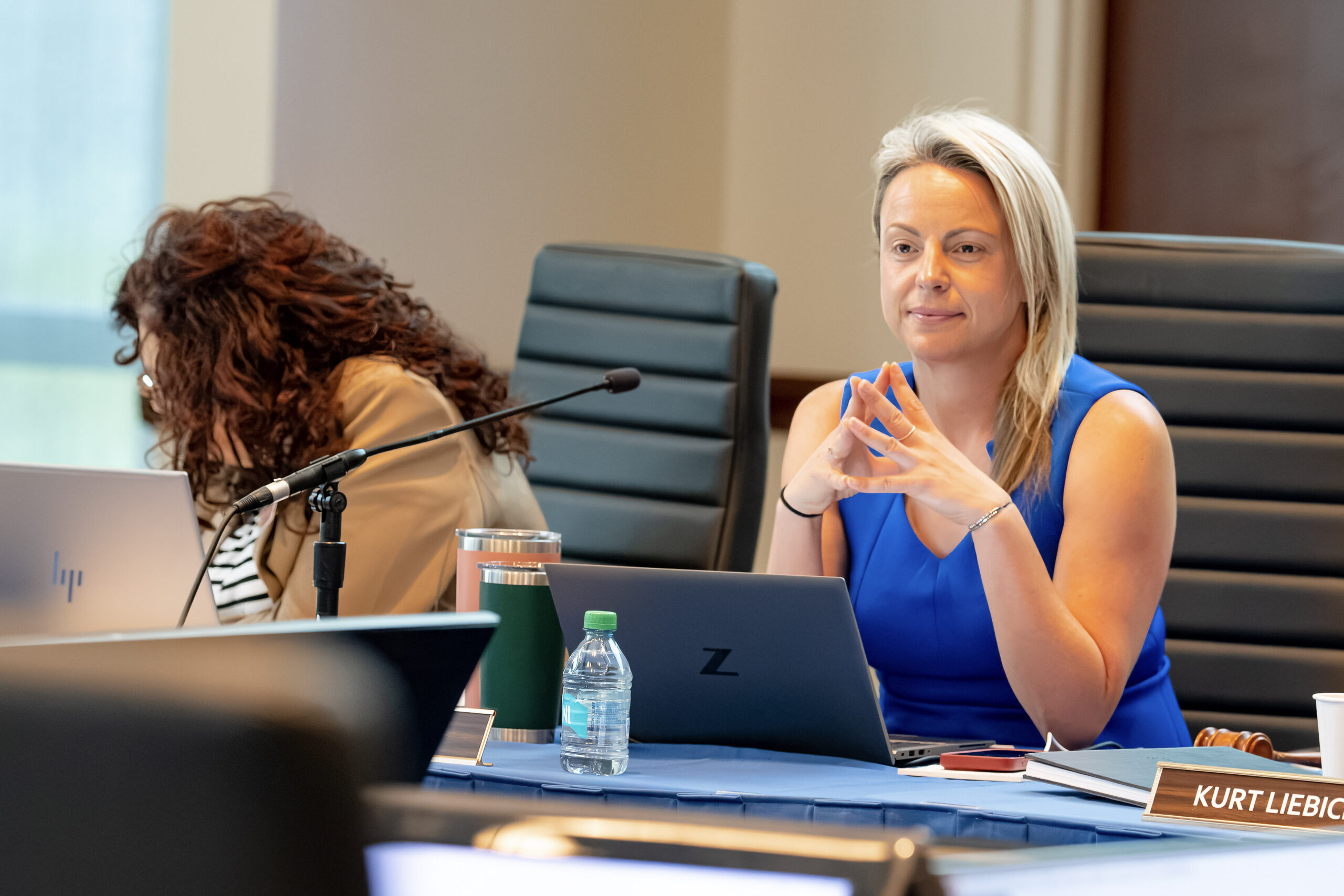 Executive Director Jenn White working at a Board meeting