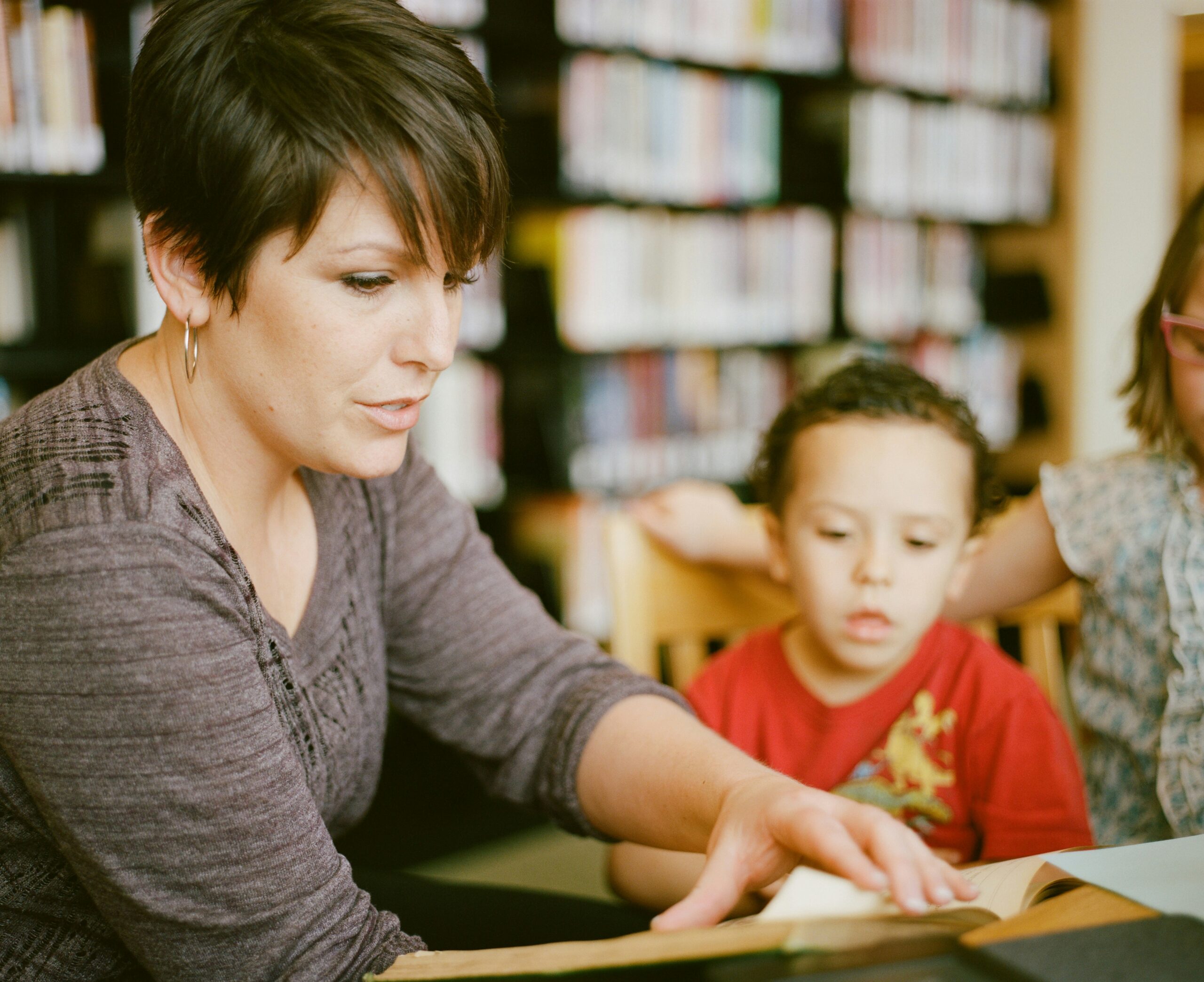 teacher engaging with a young reader