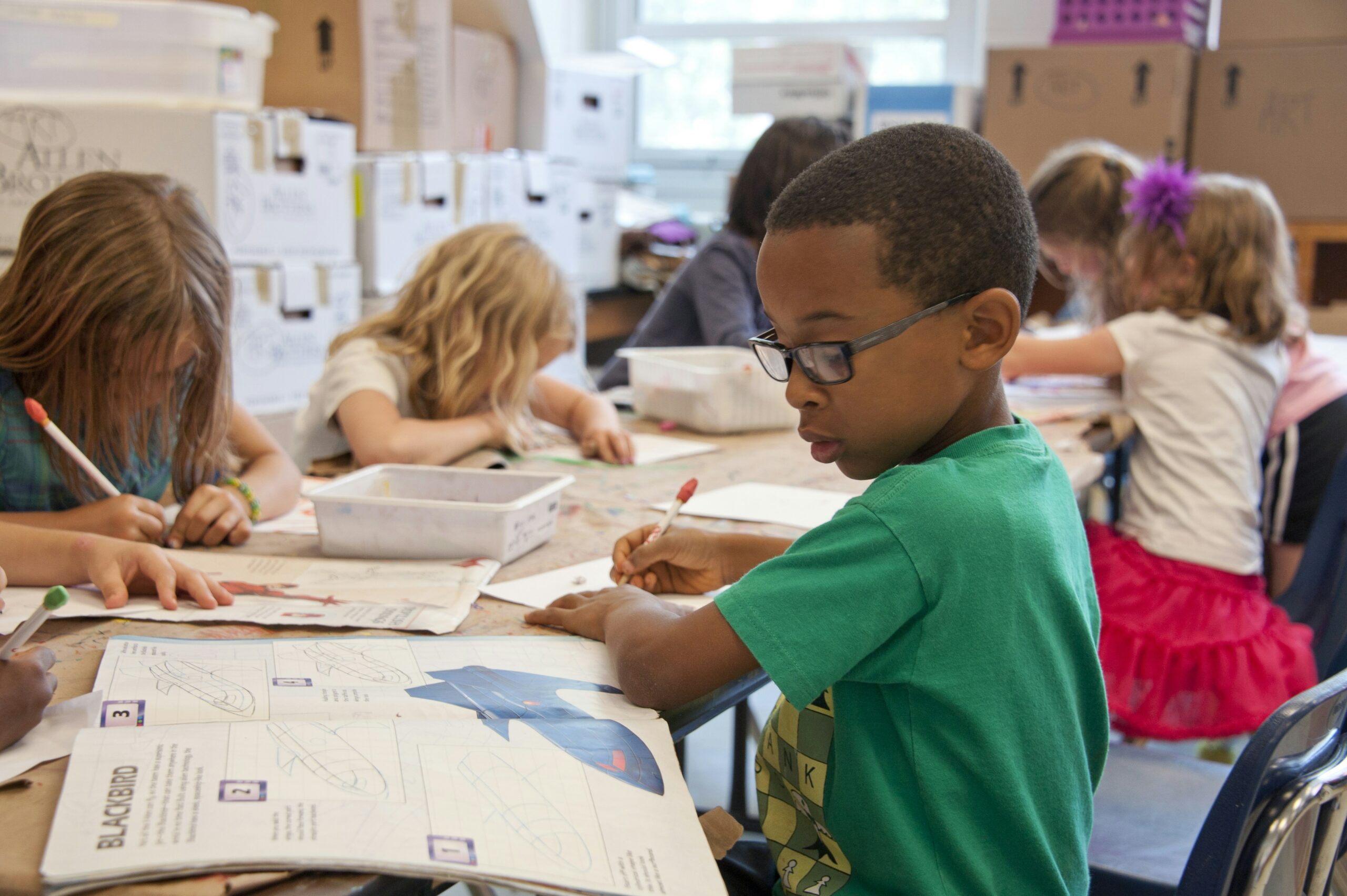 elementary students working at desks