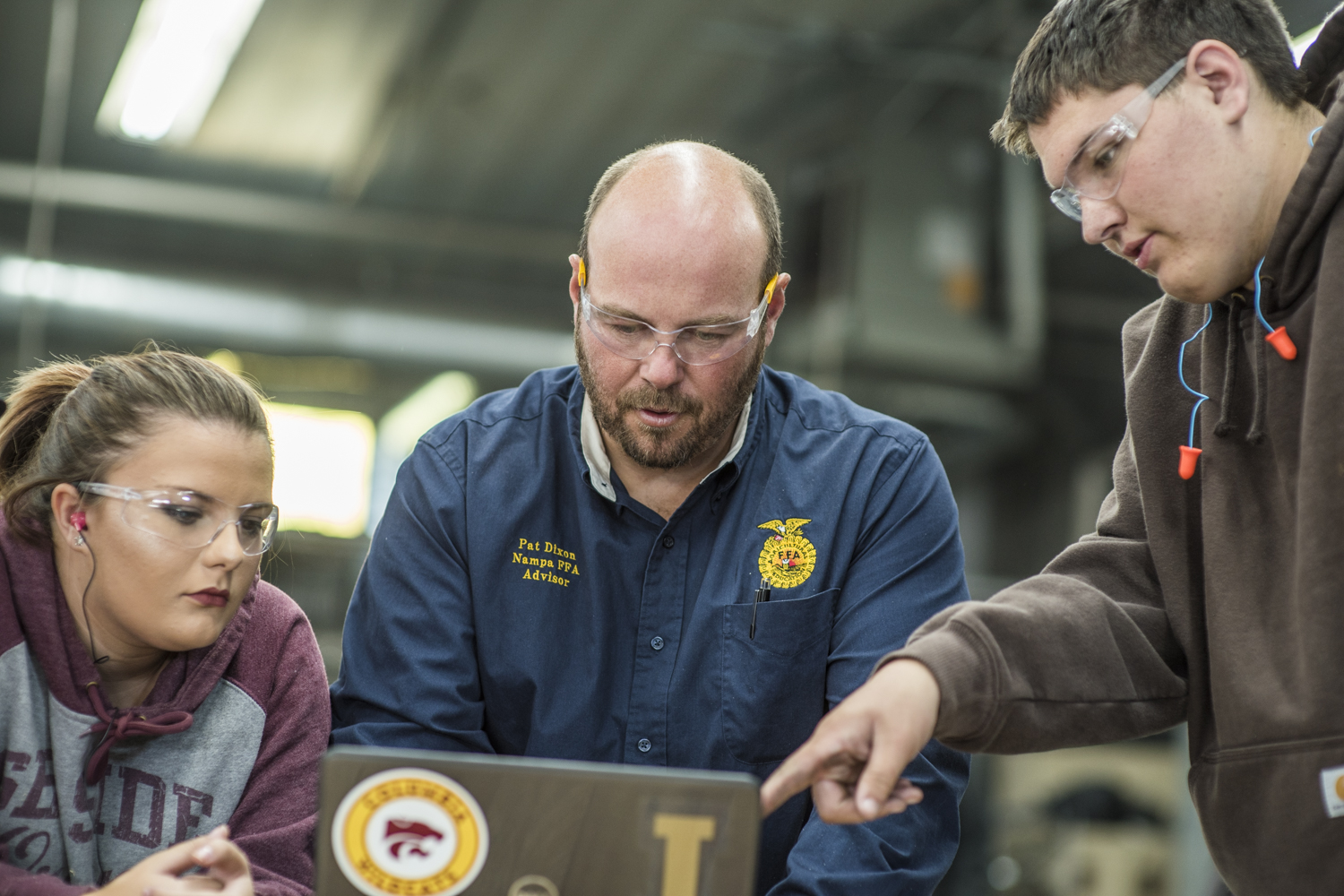 FFA advisor working with students