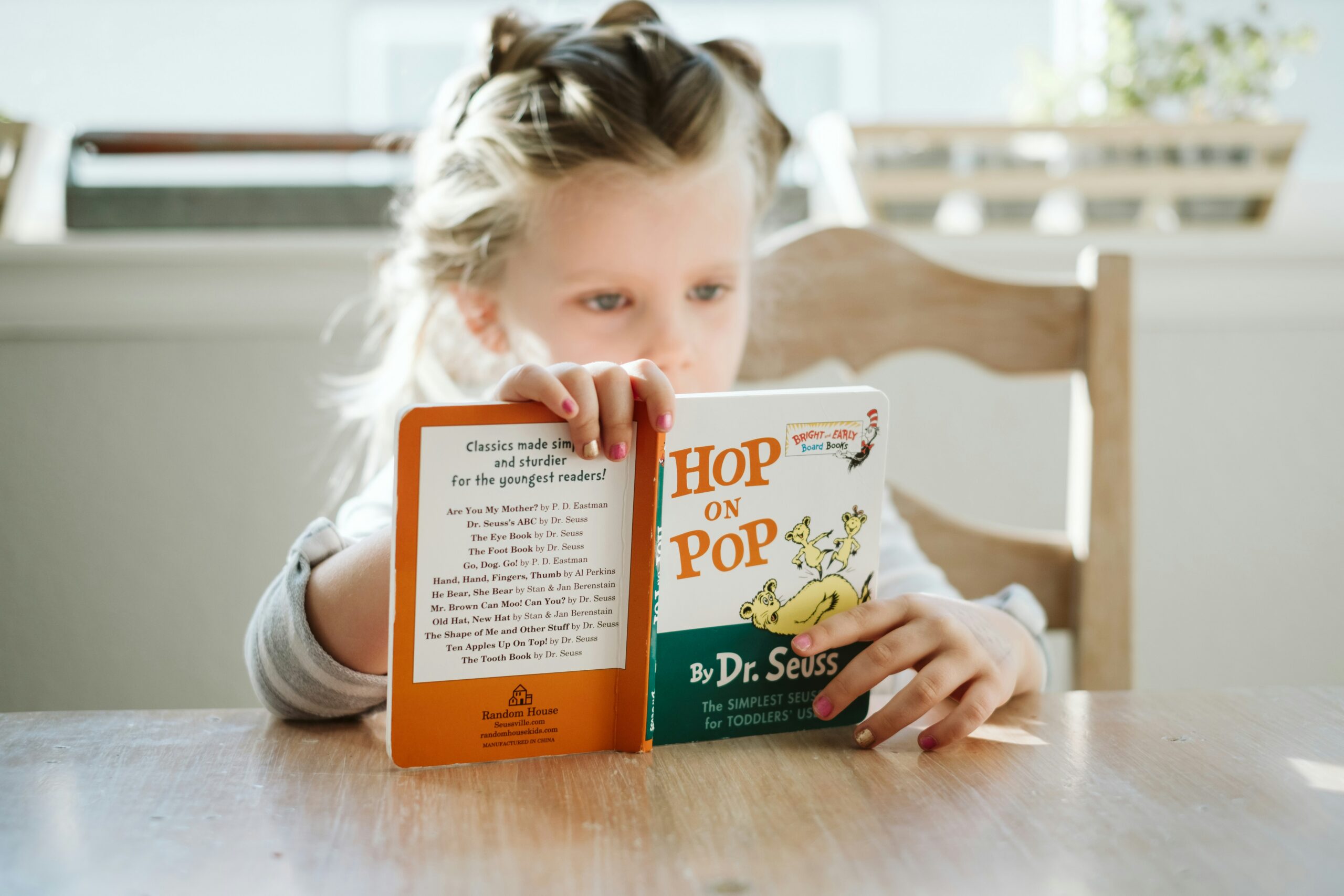 young child reading a book
