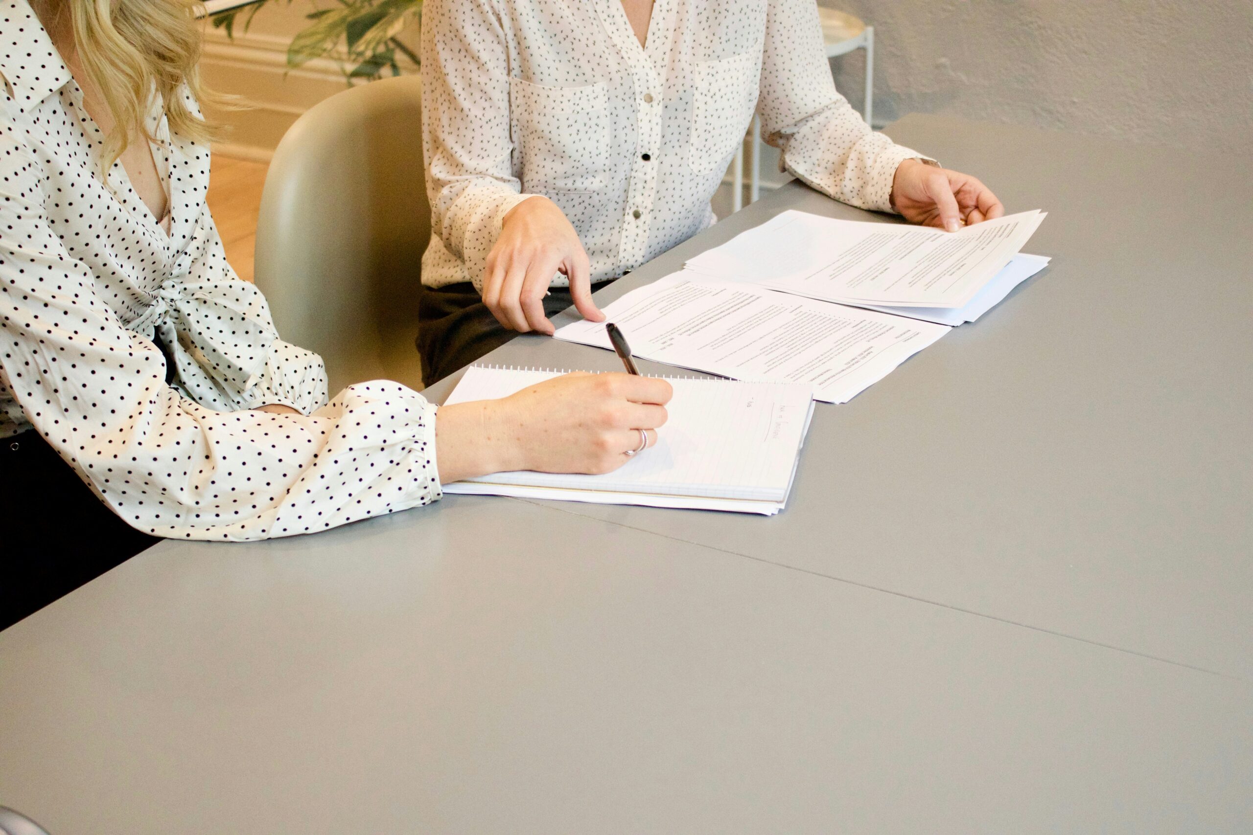 Two people reviewing reports
