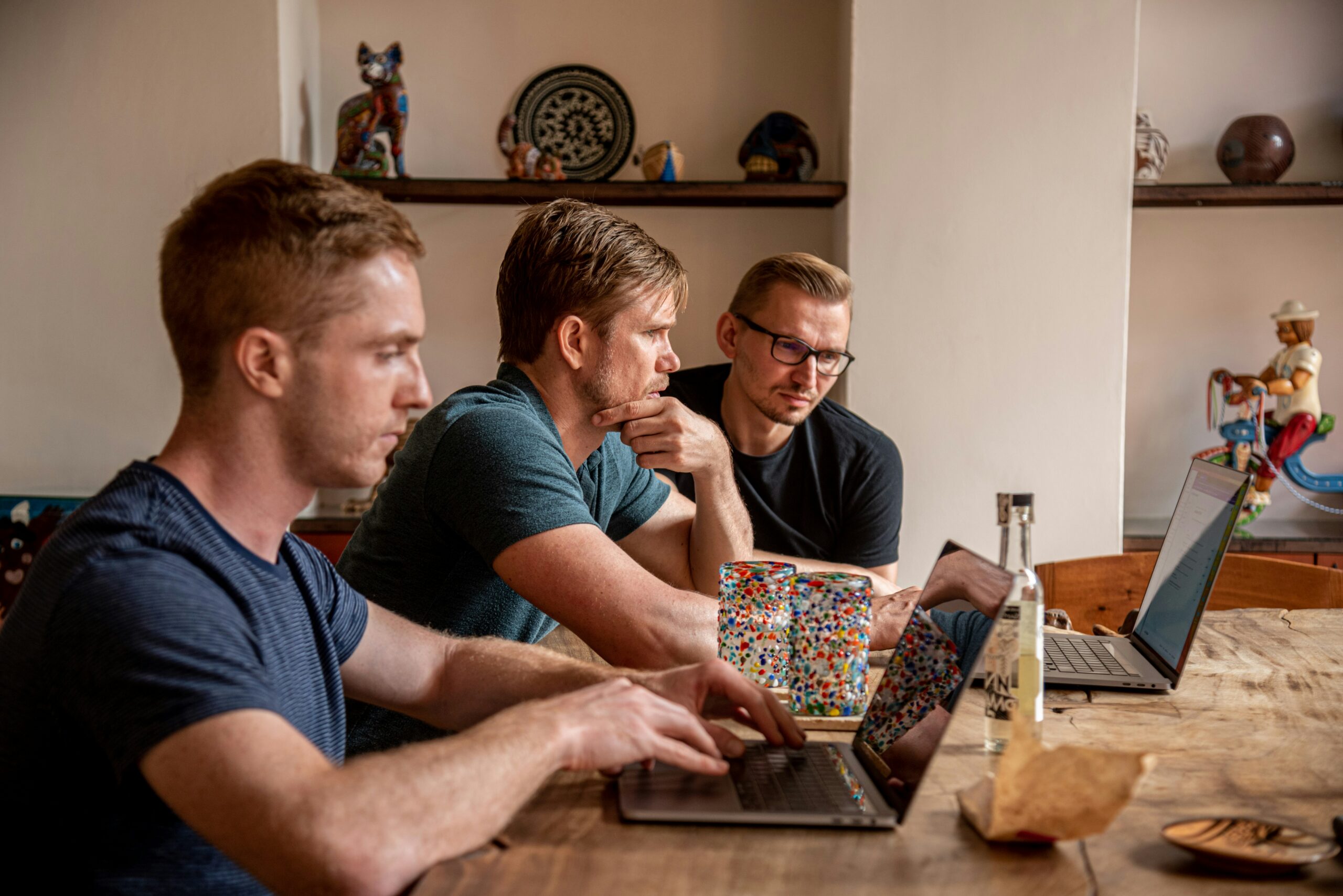 Three men working on a strategic plan