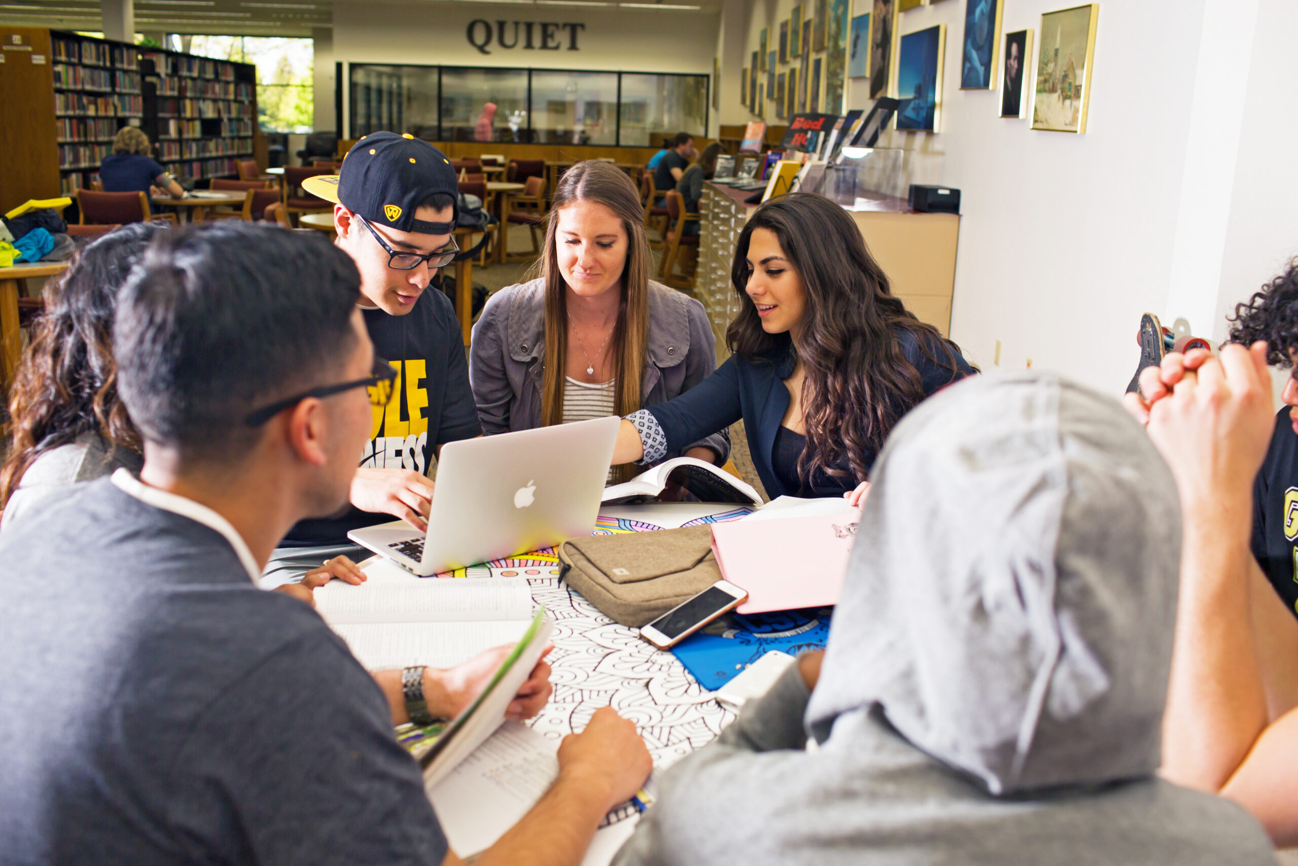 Students collaborating in library
